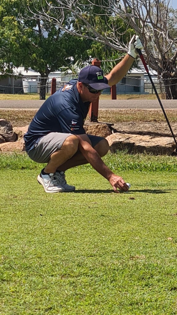 Member placing the ball on the tee