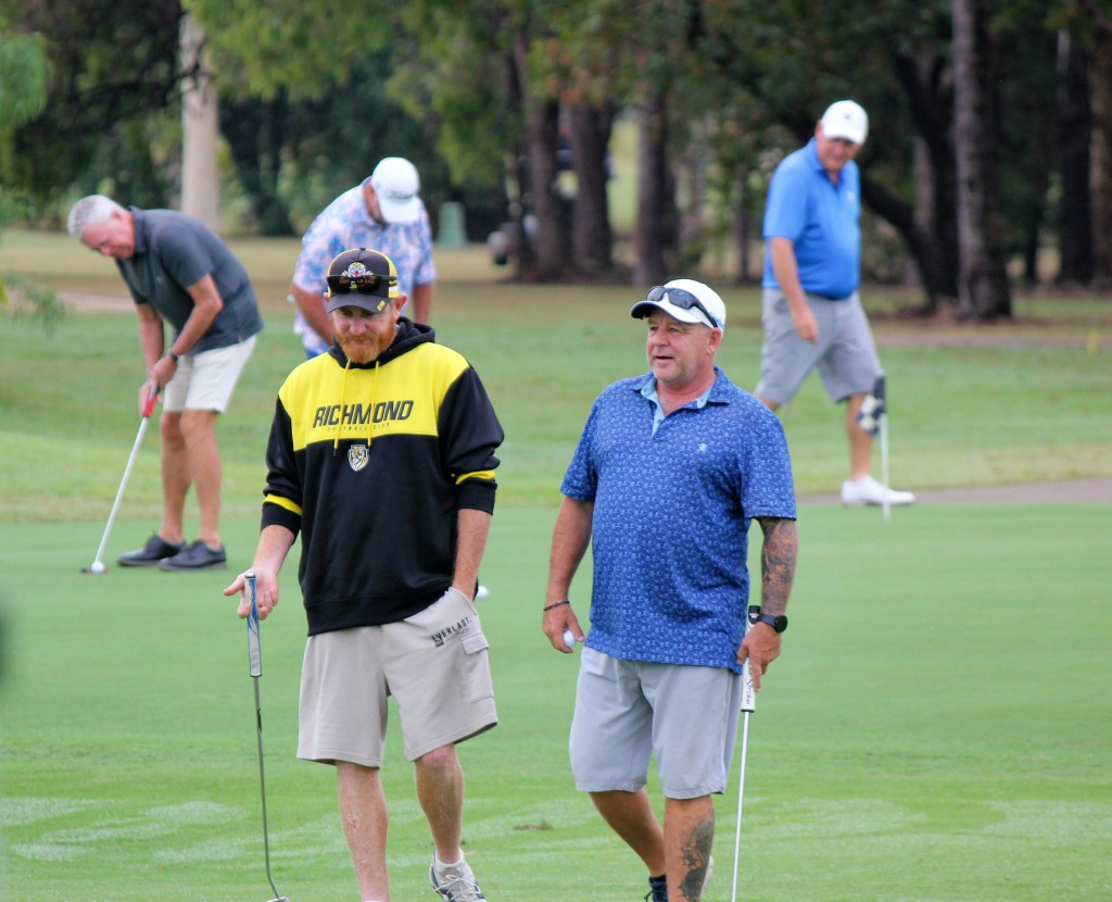 Mates walking on the green together