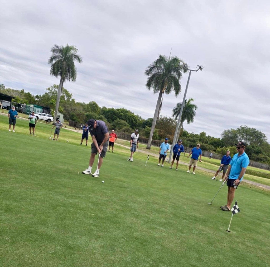Putting practice with palm trees in the background
