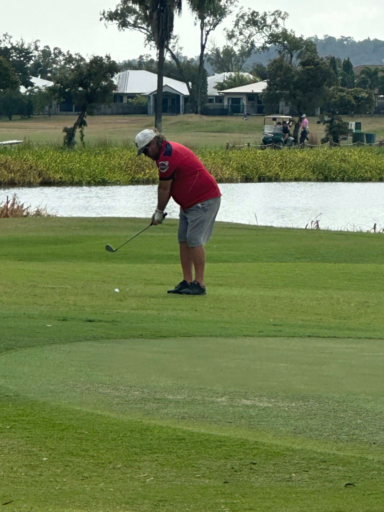 Member hitting a tee shot on the fairway