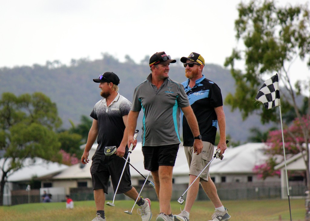 Three mates walking to the flag